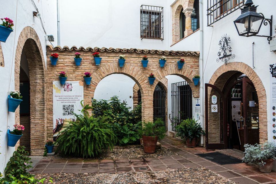 From Malaga and Costa Del Sol: Cordoba Day Trip - Alcázar of the Christian Monarchs, the Roman Bridge, and riverside views