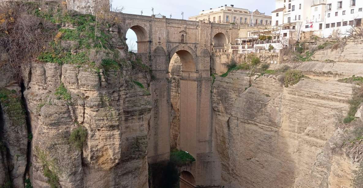 From Málaga: Ronda+Setenil de las Bodegas with Little Train - The guided Ronda walk: bullring history, old palaces, and Santa María la Mayor