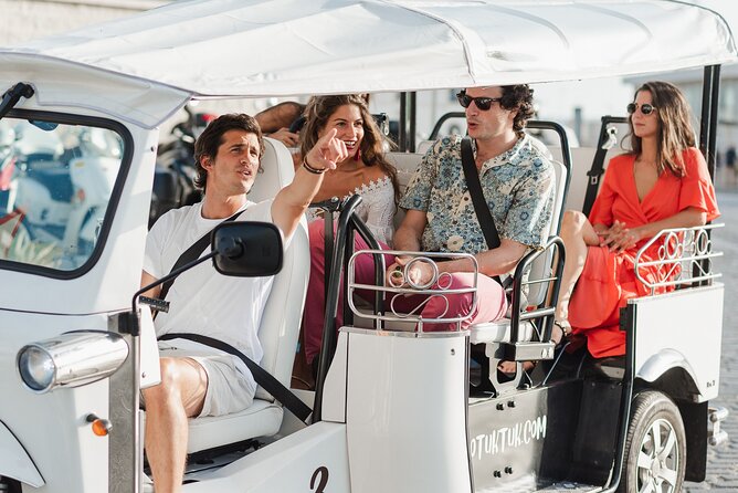 Malaga Expert Tour with Local Guide in Eco Tuk Tuk Private - La Malagueta Beach, plus Baños del Carmen on the 2-hour version
