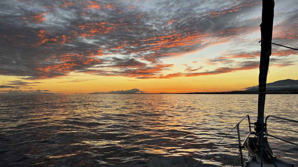 Marbella: Sunset Sailing Trip with Drinks and Snacks - What you see at sunset: colors over sea and coastline